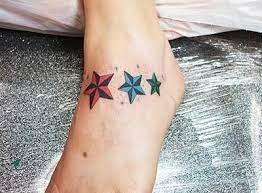 The basic nautical star design was originally derived from a simplified version of the compass rose.unlike the compass rose, however, the nautical star traditionally has five points, with the uppermost pointing toward polaris, the north star. Star Tattoos On Foot Nautical Star Tattoo Designs For Foot