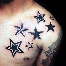 This tattoo is a combination of flowers and stars. 155 Star Tattoos That Will Make You Shine Wild Tattoo Art