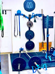 This allows space between the wall and the pegboard so you can. Garage Gym Wall Mount Olympic Plate Storage Rack Along With Wall Mount Dual Grts Ground Rotationa No Equipment Workout At Home Gym Best Home Workout Equipment