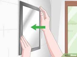 If you need to mount a heavy mirror without putting a hole in a wall, hire a professional mirror installer. 3 Simple Ways To Hang A Mirror On A Wall Without Nails Wikihow