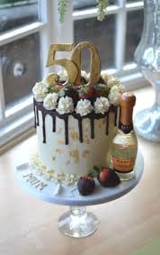 Pretty 2 tier pink and black cake with beautiful pink roses and petals. Birthday Cakes For Her Womens Birthday Cakes Coast Cakes Hampshire Dorset