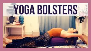 restorative yoga poses with a bolster