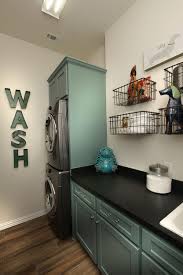 Laundry Room With Teal Cabinets The Rosella Floor Plan Drees Custom Homes Dallas Diy Living Room Decor Utility Room Designs Teal Laundry Rooms