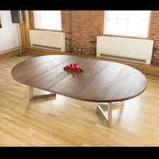 Npet extendable dining table with teak and matte white finish 15. 15 Astonishing Oval Dining Tables For Your Modern Dining Room Modern Dining Tables Oval Dining Room Table Oval Table Dining Round Extendable Dining Table