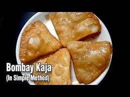 We added grated pistachios and almonds, ghee & rice flour for the fillings. Video Sweet Kaja