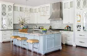 Modern farmhouse kitchen with white cabinets and dark wood floor. Kitchen Cabinet Houzz