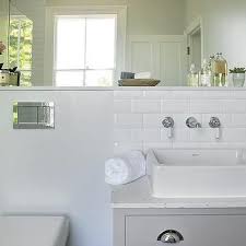 Subway tiles made their debut in new york train stations in the early 1900s,. White Beveled Subway Tiles With Vintage Style Faucet White Vessel Sink Wall Mo Beveled Subway Tile Backsplash Beveled Subway Tile White Beveled Subway Tile
