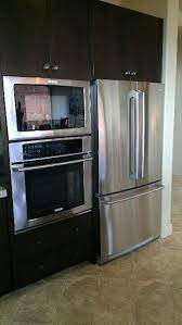 Traditionally, designers advised against putting the fridge next to the oven as it would have to work extra hard to hold its temperature, wasting energy. Stove Microwave And Fridge Next To Each Other Must Be Counter Depth Fridge Budget Kitchen Makeover Kitchen Projects Design Kitchen Design