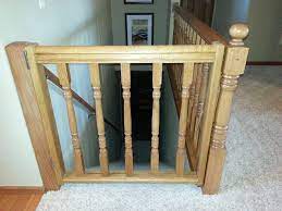 My Hubby And I Made This Gate Out Of Extra Spindles And Railing Much Safer And Not To Mention More Stylish Than Th Diy Baby Gate Banister Baby Gate Stair Gate