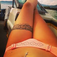 Leg garter tattoo pictures tattoo. Most Eye Catching Thigh Garter Tattoos Tattoo Designs For Women