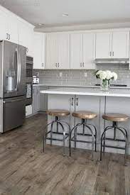 Providing a neutral backdrop, white kitchen cabinets can be left alone or dressed up with colorful art bring a little pep to white kitchen cabinets with a colorful backsplash. 25 Timeless Grey And White Kitchen Designs Digsdigs