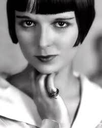 1920s actress Louise Brooks channeling her inner Cleopatra! 🔥 wearing a  beautiful serpentine asp ring. From a Eugene Robert Richee fashion photo  session, 1928.