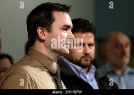 Ryan Rule, left, president of the union representing Boeing engineers  (SPEEA), speaks as Jon Holden, Boeing Machinists District 751 president,  looks