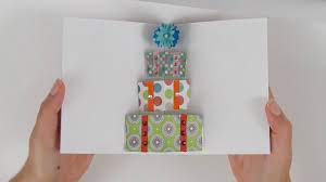 If the paper is bigger than you'd like, cut the card to size and then fold. How To Make A Pop Up Card With Gift Boxes Youtube