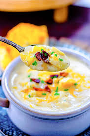 All your favorite baked potato toppings—bacon, cheddar, sour cream, green onions—in a spoon with this recipe from delish.com. Creamy Potato Soup Recipe Soulfully Made