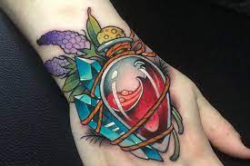 A colorful depiction of an overlapping star of david comprises this tattoo. Top 73 Best Hand Tattoos For Women 2021 Inspiration Guide