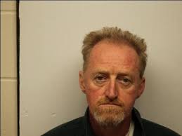 Feds charge man in car fire injury