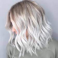 Short icy blonde hair with dark roots. Why Ice Blonde Is The Coolest Hair Trend Right Now Wella Professionals