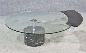 Use the low coffee table on its own or build a complete living room furniture set with the matching cyra end tables, 60w tv stand and console table (coordinating items sold separately). Lot Art Marble Glass Swivel Coffee Table