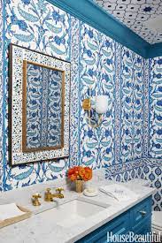 This bathroom has blue walls, white doors, and white tile flooring. 12 Best Blue Bathroom Ideas How To Decorate Blue Bathrooms