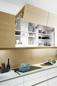 Solid wood kitchen cabinets provide a beautiful collection of flawless solid oak doors and drawer frontals to match our kitchen cabinet range. Leicht Concrete Topos Electric Rising Cabinet Doors In Oak Finish Kitchen Cabinets Leicht New York