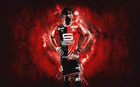 Want to discover art related to camavinga? Download Wallpapers Eduardo Camavinga Stade Rennais Fc Srfc Rennes French Footballer Portrait Red Stone Background For Desktop Free Pictures For Desktop Free