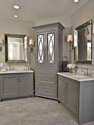 Tile on the walls to the ceiling, a wood ceiling, and simple wood crown. Crown Molding Panelized Ends Inset Doors With Beaded Face Frames Gray Paint Grey Cabine Corner Bathroom Vanity Bathroom Remodel Master Bathroom Countertops