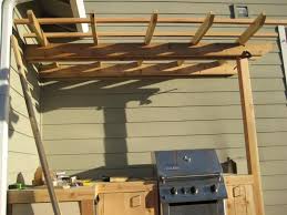 You can make a simple sort of table which has two levels for storing items on them. How To Build Outdoor Kitchen Cabinets
