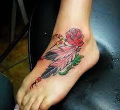 Rose With Feather Tattoo On Left Foot Ankle Ankle Tattoo Designs Feather Tattoo Ankle Rose Tattoos