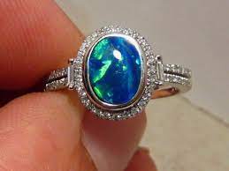 Blue Opal Engagement Ring Ok I Want That Just As A Ring Not An Engagement Ring Haha Engagement Rings Opal Opal Engagement Black Opal Engagement Ring