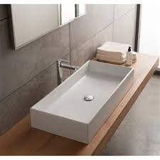 white ceramic rectangular vessel sink