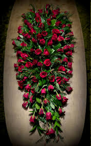 Roses have a universal meaning that makes them ideal as a funeral flower. Gorgeous Red Rose Funeral Casket Spray Casket Flowers Funeral Flowers Funeral Flower Arrangements