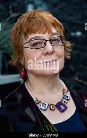 Gardening writer Anne Wareham in her conservatory, at her home in Devauden,  Monmouthsire Stock Photo