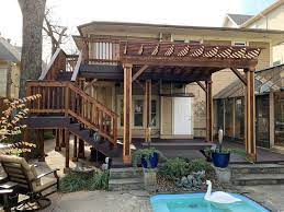 Wash the wood with a deck cleaner and scrub the wood surface with a brush while wet. First And Second Floor Deck With Extended Pergola Rustic Terrace Dallas By Allen Rustic Wood Designs Llc Houzz