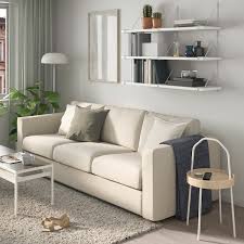 If your living room is full of books stop your shelving from looking too chaotic by using baskets to group books together. Bergshult Pershult Wall Shelf Combination White White Ikea
