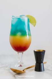 Rainbow Paradise Cocktail With Blue Curacao Vega Recepten Recipe Orange Juice And Vodka Malibu Cocktails Cocktails With Blue Curacao
