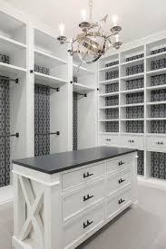 Black And White Comfort Room Design Well Appointed White And Gray Walk In Closet Features A Visual Comfort Armillary 6 Light Chan Master Closet Design Bedroom Organization Closet Closet Built Ins