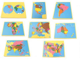 Set on a floor mat, the pieces of the continent map are removed individually, as the teacher introduces the name for each continent. Montessori Geography Puzzle Maps Pink Montessori