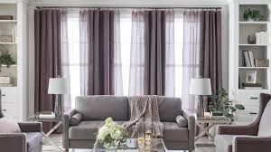Pink pastel curtains in living room and yellow designer chair How To Choose Window Curtains For Your Living Room Style By Jcpenney