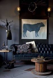 Home Design And Decor Masculine Interior Designs Masculine Interior With Black Leather Couch And Coat Rack And R Deco Deco Interieure Decoration Interieure
