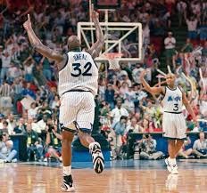 Orlando Magic Center Shaquille O Neal 32 Runs Down The Court Giving The Number One Sign After Making A Slam Dunk During Shaquille O Neal Basketball Nba Teams