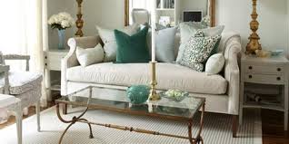 A brown sofa directly resembles the color of rich soil and is repeated within the armchair upholstery's stripe. 13 Decor Ideas For Light Teal Living Room Teal Living Rooms Living Room Designs Living Room