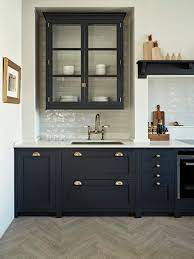 The kitchen has a mix of materials, including stainless steel, enameled cabinets, ceramic tile and black marble. Simple Kitchen Ideas Contemporary Kitchen Remodel Design Blue Kitchen Cabinets Blue Shaker Cabinets