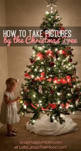 Christmas Tree Pictures How To Take Adorable Photos With The Kids Christmas Tree Pictures Christmas Photography Christmas Photos