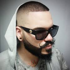 Inspired by historic nordic warriors, the viking haircut encompasses many different modern men's cuts and styles, including braids, ponytails, shaved back and sides, a mohawk, undercut, and epic beard. Beard Fade Shaved Head Novocom Top