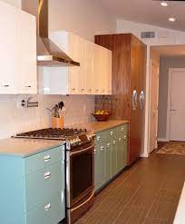 Before starting a kitchen paint job, empty the cabinets, clear off the counters, and remove freestanding appliances. Sam Has A Great Experience With Powder Coating Her Vintage Steel Kitchen Cabinets Retro Renovation Kitchen Cabinet Remodel Turquoise Kitchen Cabinets Steel Kitchen Cabinets