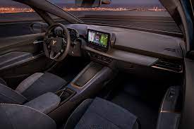 One shows textured trim and bronze accents, while the other reveals a slender center console covered in upholstery and even. New 2021 Cupra Born Ev Hot Hatch Prepares For Imminent Launch Autocar