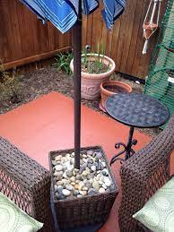 Thanks Pinterest For The Umbrella Stand Idea Fill It Mostly With Non Decorative Rocks Patio Umbrella Stand Outdoor Umbrella Stand Outdoor Patio Umbrellas