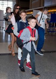 Victoria Beckham Legs It Through Lax With All Four Kids David And Victoria Beckham David Beckham Family The Beckham Family