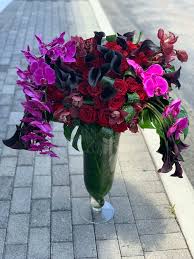 A flower that grows near water sources. Luxe Flower Design In Tall Vase By Luxury Flowers Miami